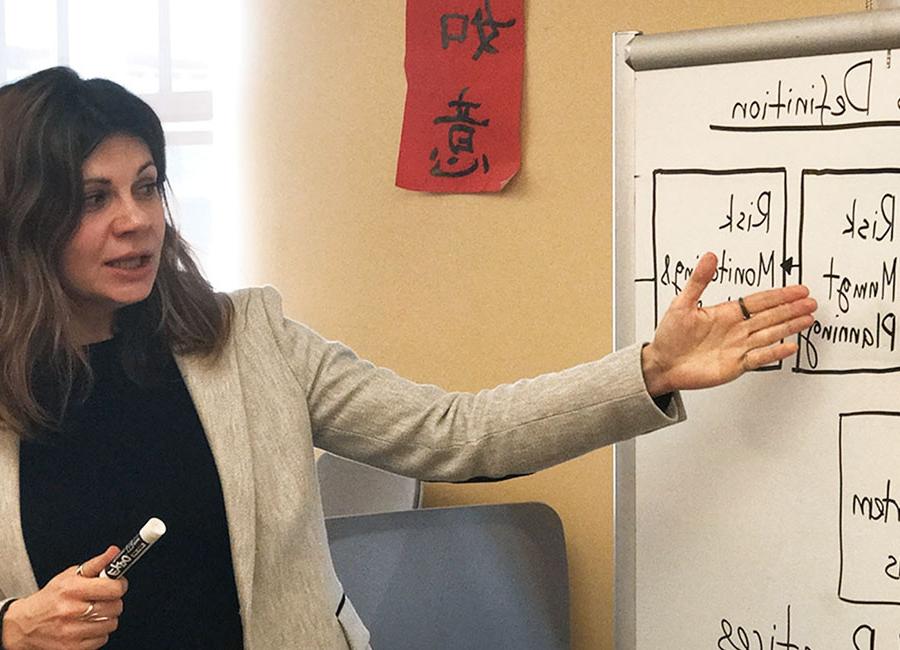 female student presenting for a course in the part time master's degree